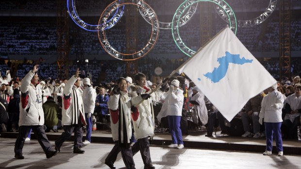 Korean flag-bearer's Bora Lee and Jong-In Lee carry a unification flag during the 2006 Winter Olympics opening ceremony in Turin, Italy.