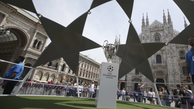 Pride of place: the Champions League trophy is placed in front of the gothic cathedral in Milan.