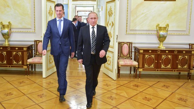 Syrian President Bashar al-Assad (left) and Russian President Vladimir Putin arrive for their meeting.