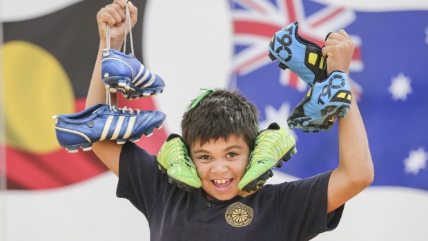 Mildura Primary student Kenneth Hudson is thrilled with the donated boots.