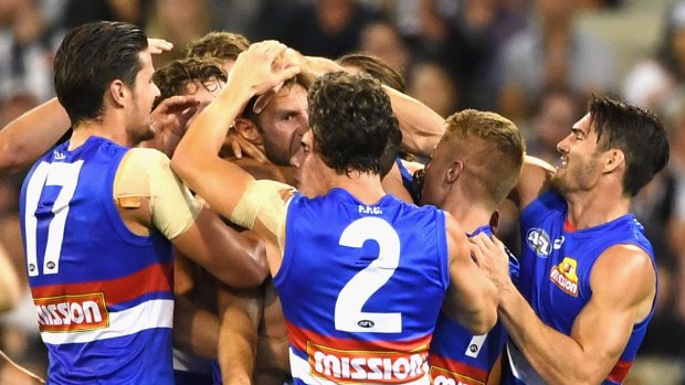 Travis Cloke is congratulated by teammates after his goal.
