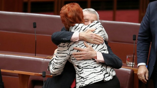 Senator Roberts is congratulated by Senator Pauline Hanson after delivering his first speech.