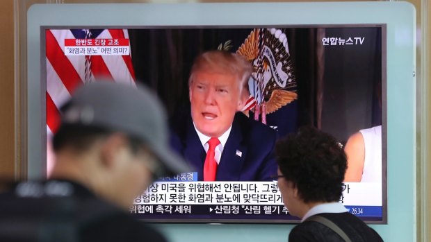 A local news program broadcasts Donald Trump's remarks at the Seoul Train Station in Seoul, South Korea.