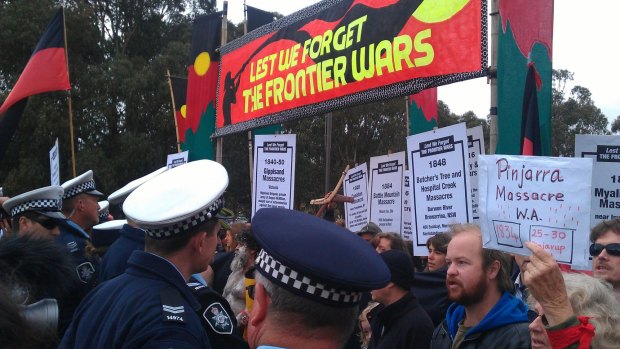 Protesters attempting to crash the 2014 Anzac Day march in Canberra clash with police.