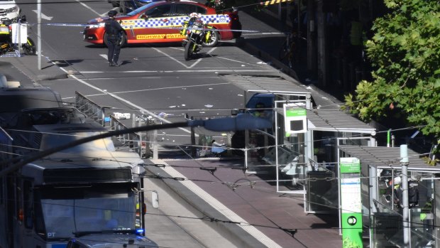 The scene at the corner of Flinders and Elizabeth Street in the city where a car drove through a pedestrian crossing.