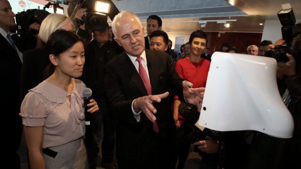 Prime Minister Malcolm Turnbull with the Teleport robot developed by Marita Cheng at Engineers Australia in Melbourne.