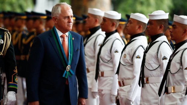 Malcolm Turnbull reviews the ceremonial guard in Manila during his welcome to Camp Aguinaldo to view a demonstration from Filipino soldiers trained by Australian soldiers.