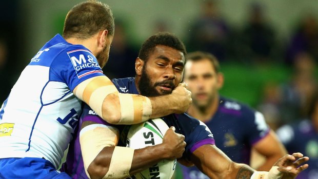 Marika Koroibete of the Storm is unable to find a way through the Bulldogs' defence.