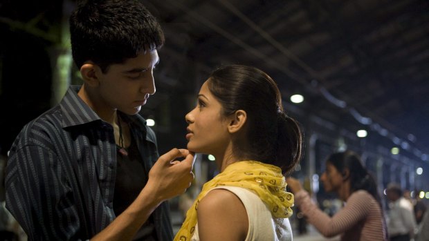 Dev Patel as Jamal Malik and Freida Pinto as Latika in <i>Slumdog Millionaire</i>.
