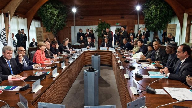 Global heads: G7 leaders and outreach guests including Germany's Chancellor Angela Merkel and US President Barack Obama attend a working session at the summit. 