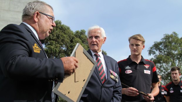 Barry Gracey (left) with World War II veteran Jack Jones and young Essendon players at Pozieres earlier this year. Mr Gracey and his wife Yvonne will receive the Legion d'Honneur for their efforts to have the history of Pozieres recognised.