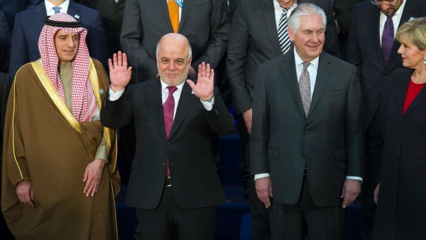  A penny for your thoughts: Iraqi Prime Minister Haider al-Abadi (hands raised) with US Secretary of State Rex Tillerson and Foreign Minister Julie Bishop in Washington on March 22.