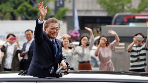 South Korea's President Moon Jae-in greets supporters after his inauguration ceremony in Seoul.