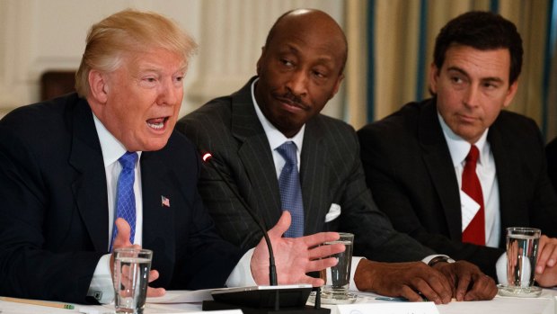 Trump, left,meeting with manufacturing executives in February, including Kenneth Frazier, centre.