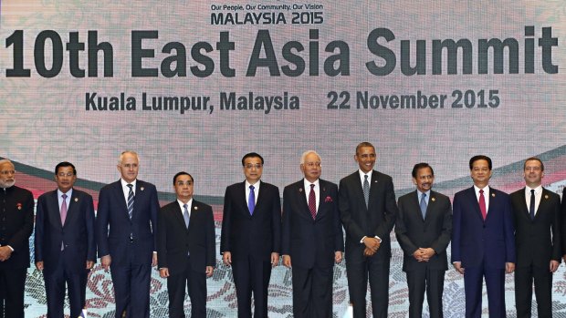U.S. President Barack Obama and other leaders participate in the East Asia Summit family photo in Kuala Lumpur, Malaysia, Sunday, Nov. 22, 2015. Obama is in Malaysia where he joins leaders from Southeast Asia to discuss trade and economic issues, and terrorism and disputes over the South China Sea. Other leaders are from left: India's Prime Minister Narendra Modi, Cambodia's Prime Minister Hun Sen, Australia's Prime Minister Malcolm Turnbull, Laos' Prime Minister Thongsing Thammavong, Chinese Premier Li Keqiang, Malaysia's Prime Minister Najib Razak, Obama, Brunei's Sultan Hassanal Bolkiah, Vietnam's Prime Minister Nguyen Tan Dung, and Russia's Prime Minister Dmitry Medvedev.  (AP Photo/Susan Walsh)