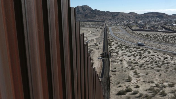 The Mexico-US border fence separating the towns of Anapra, Mexico, right, and Sunland Park, New Mexico, left. White House budget documents show Donald Trump wants billions of dollars to start building a new wall at the border.