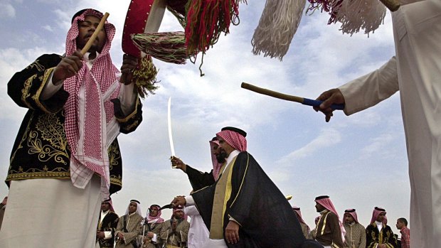 Qatari men of the Bani Yafe tribe performing the traditional sword dance during Sheikh Tamim's wedding ceremony in Doha.