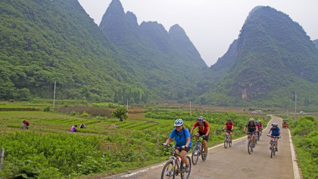 Cycling past limestone peaks near Xingping Yangshou.