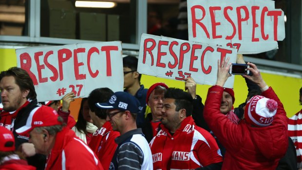 Supportive: Swans fans show their respect for outgoing champion Adam Goodes in an otherwise bad year for spectator culture at football games.