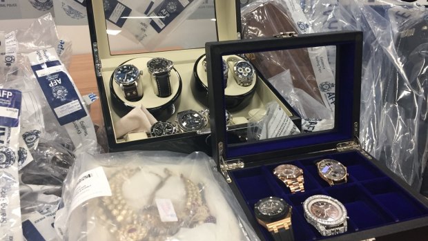 Police have seized hundreds of items, including watches, cars, motorbikes, planes, properties and cash.