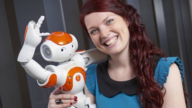 Deanna Hood with a Nao robot.