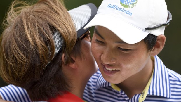 Australia's Min Woo Lee embraces his mother, Clara.