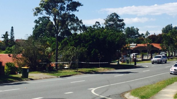 Police at the scene of a crash at Molendinar, on the Gold Coast, where a woman was allegedly assaulted.