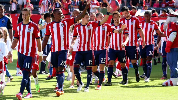 Chivas USA players wave to fans before a game this season.