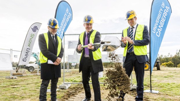 Happier times: There's a rift between the Brumbies and University of Canberra two years after construction started on a new rugby base at UC. UC Vice-Chancellor Professor Stephen Parker, left, with Chief Minister Andrew Barr, centre, and former Brumbies boss Andrew Fagan.