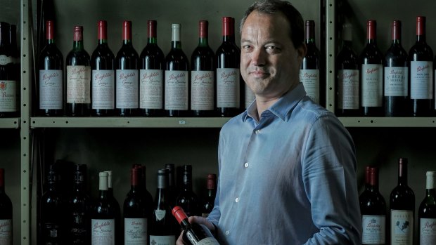 Nick Stamford holding the bottle of 1951 Grange.