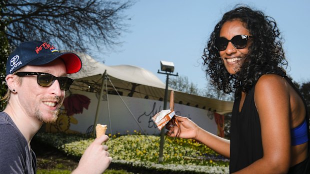 Jesse Armitstead and Shani Rajendra cool down with ice creams at Floriade.