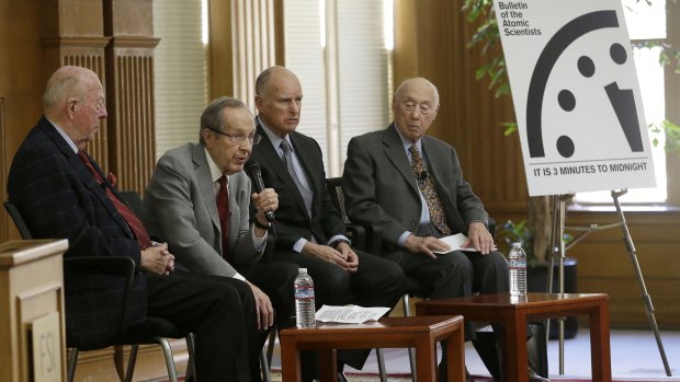 Former US secretary of defence William Perry (second from left) next to former US secretary of state George Shultz, Governor Jerry Brown and Jerry Seelig after the unveiling of the Doomsday Clock, which measures the likelihood of a global cataclysm.