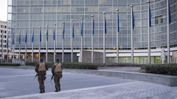 Soldiers patrol outside the European Council building in Brussels on Monday.