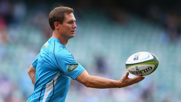 Brumbies coach Stephen Larkham will wait until after the World Cup to decide if he can juggle two coaching jobs.