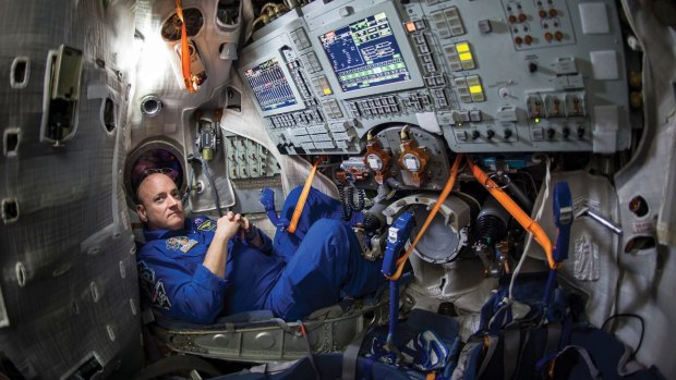 NASA Astronaut Scott Kelly is seen inside a Soyuz simulator.