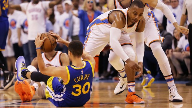 Down and out: Steph Curry gets acquainted with the floor.