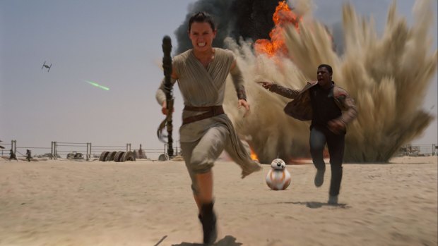 Daisy Ridley as ace pilot Rey  and John Boyega as Finn in <i> Star Wars: The Force Awakens</i>.