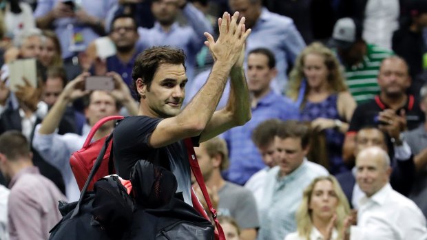 Captivating even when he doesn't win: Roger Federer leaves the court after losing to Juan Martin del Potro in the US Open.