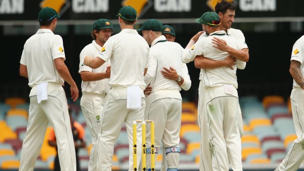 Australia celebrate  after Mitchell Starc took the wicket of Trent Boult to seal victory by 208 runs in the first Test.