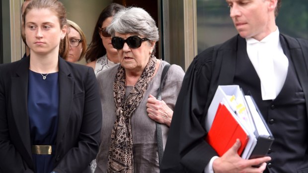 Maggie Kirkpatrick (centre) leaves the County Court in Melbourne on Monday.