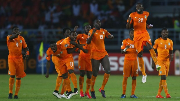 Ivory Coast's players celebrate their win.