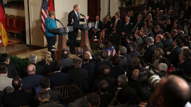 President Trump and the German chancellor, Angela Merkel, at their news conference at the White House on Friday.