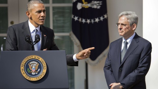 He's my guy: Barack Obama points to Merrick Garland, the man he will nominate to the US Supreme Court. 