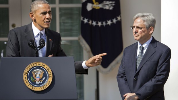 He's my guy: Barack Obama points to Merrick Garland, the man he will nominate to the US Supreme Court. 