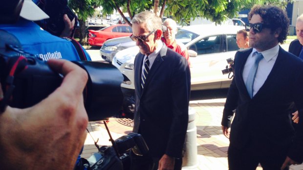 LEGAL ISSUES: Gold Coast Titans player Beau Falloon arrives with his lawyer at Southport Magistrates Court.