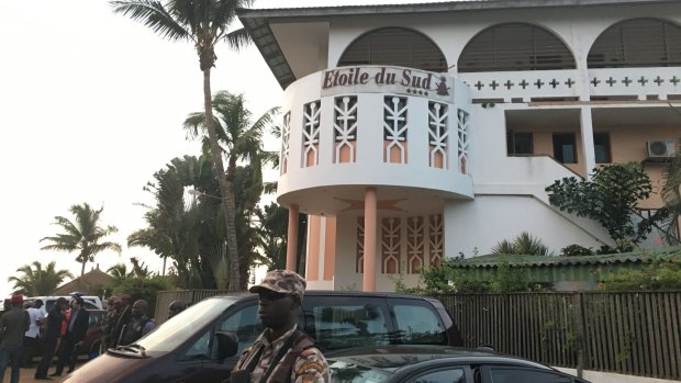 A soldier stands guard outside the Etoile du Sud hotel, one of the Grand Bassam hotels attacked on Sunday.