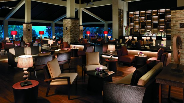 Soft lighting gives the lobby lounge at Shangri-La's Rasa Ria Resort & Spa an intimate mood. 