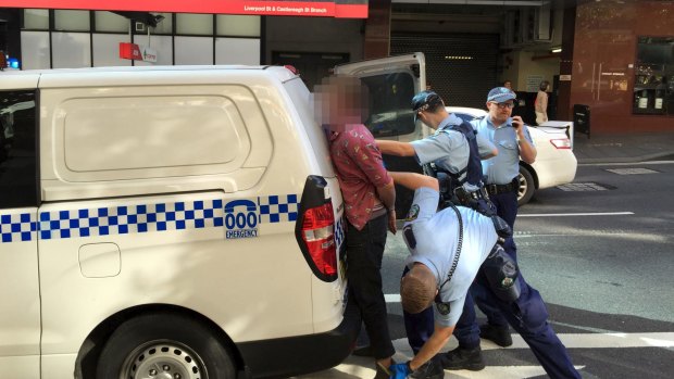 A man has been taken away by police after an incident that locked down Sydney's Downing Centre court complex in Sydney.