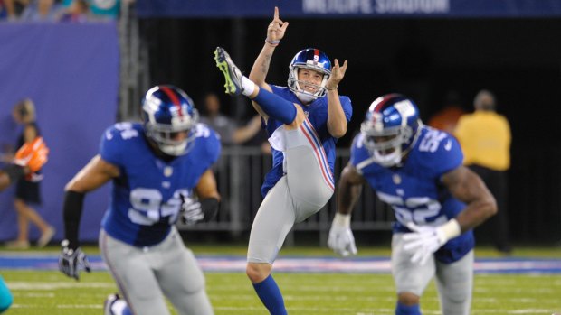 New York Giants' Australian punter Brad Wing (centre) is heading to the NFL play-offs.