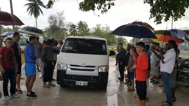 A supplied image of asylum seekers leaving the Manus Island detention centre on Sunday.